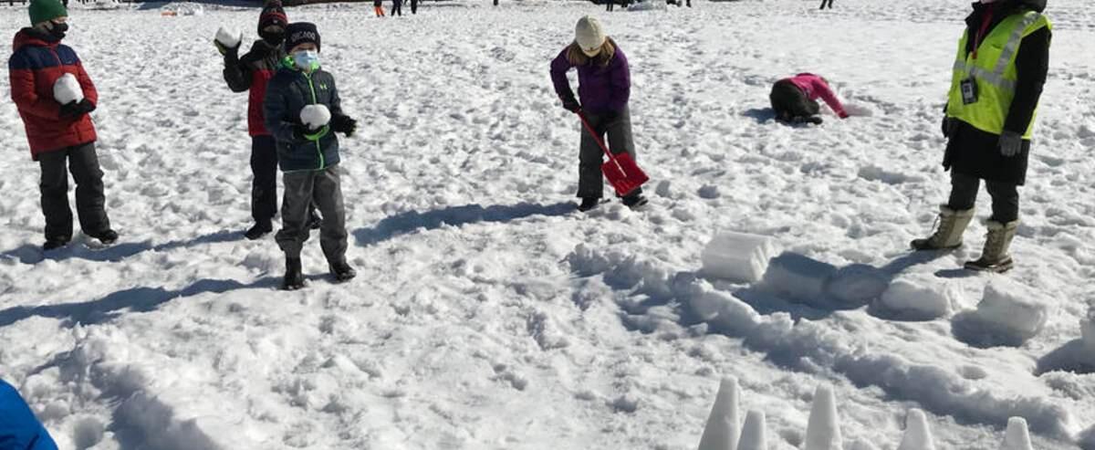 Students playing in the snow at recess
